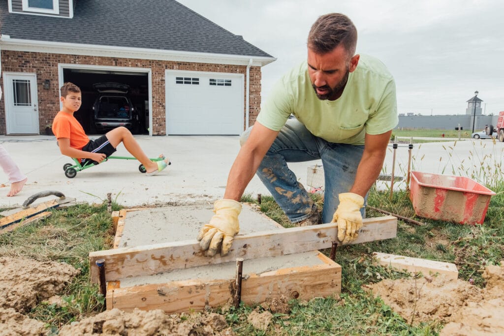 Image of man finishing a concrete pad