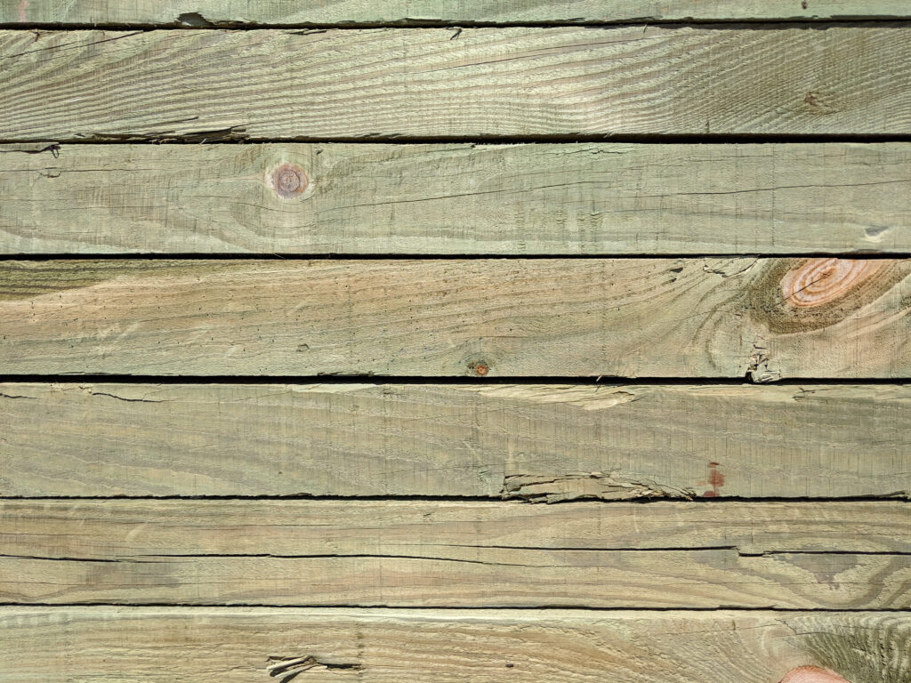 Close-up of pressure treated wood planks of a deck