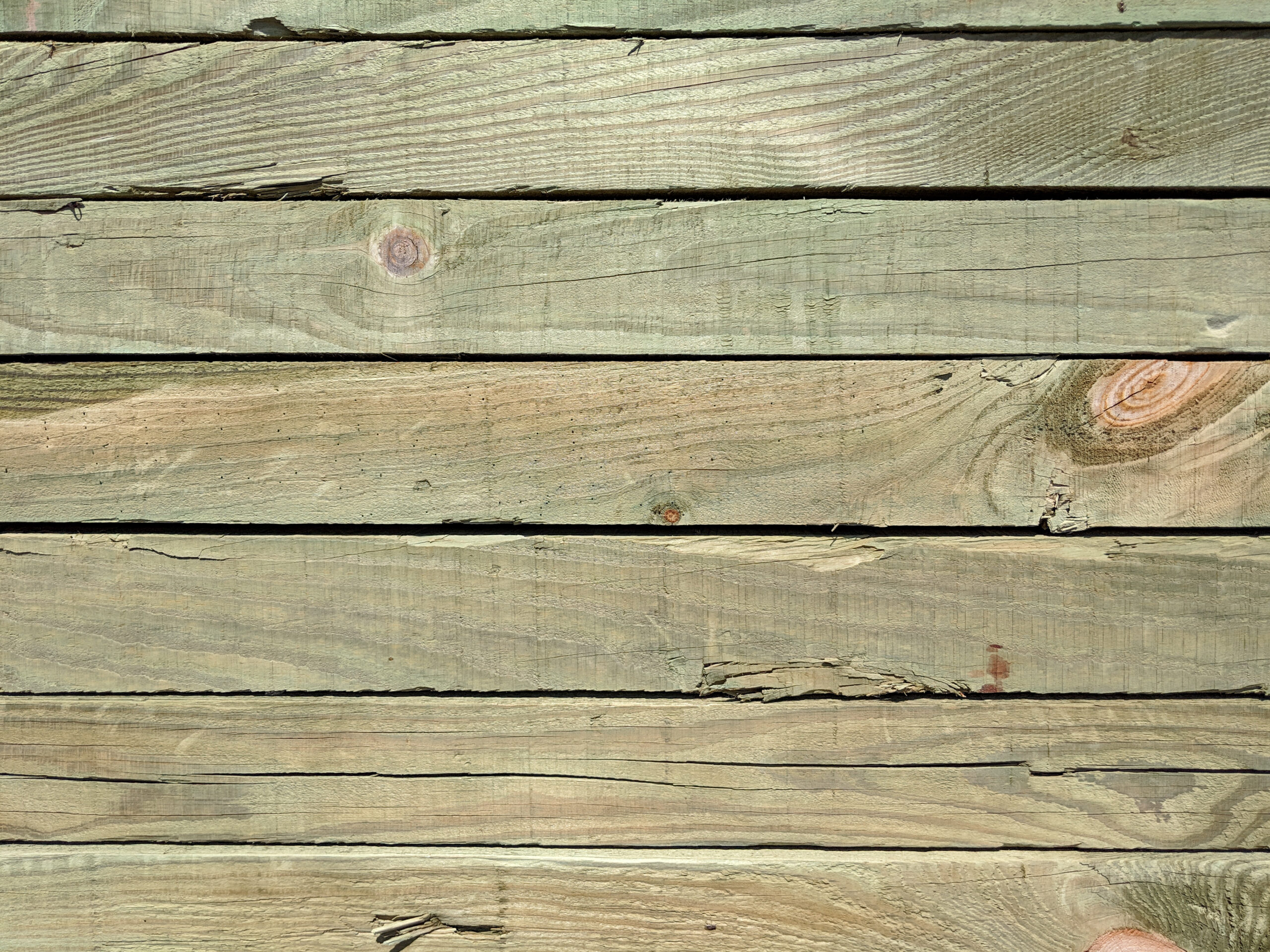 Close-up of pressure treated wood planks of a deck