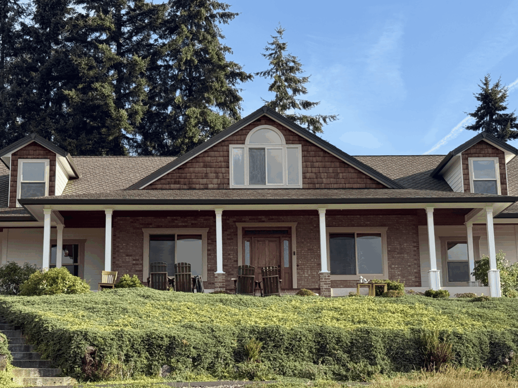 Image of a house with a cedar shake shingle roof freshly sealed with Presidential Shingle Oil