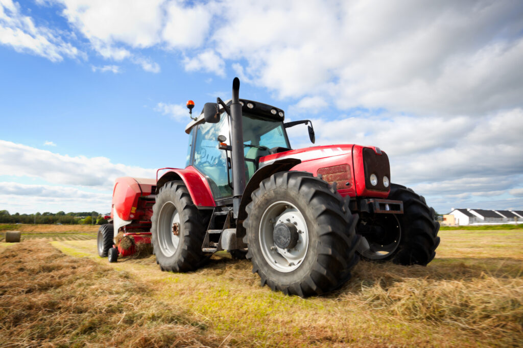 tractor collecting haystack in the field,panning technique