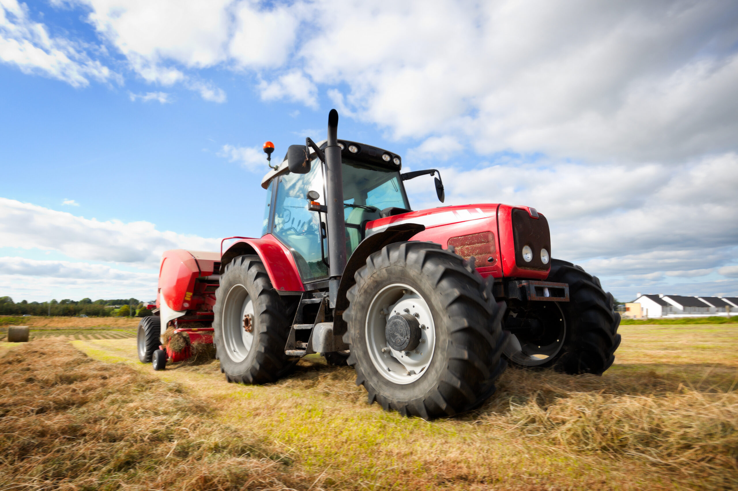 tractor collecting haystack in the field,panning technique